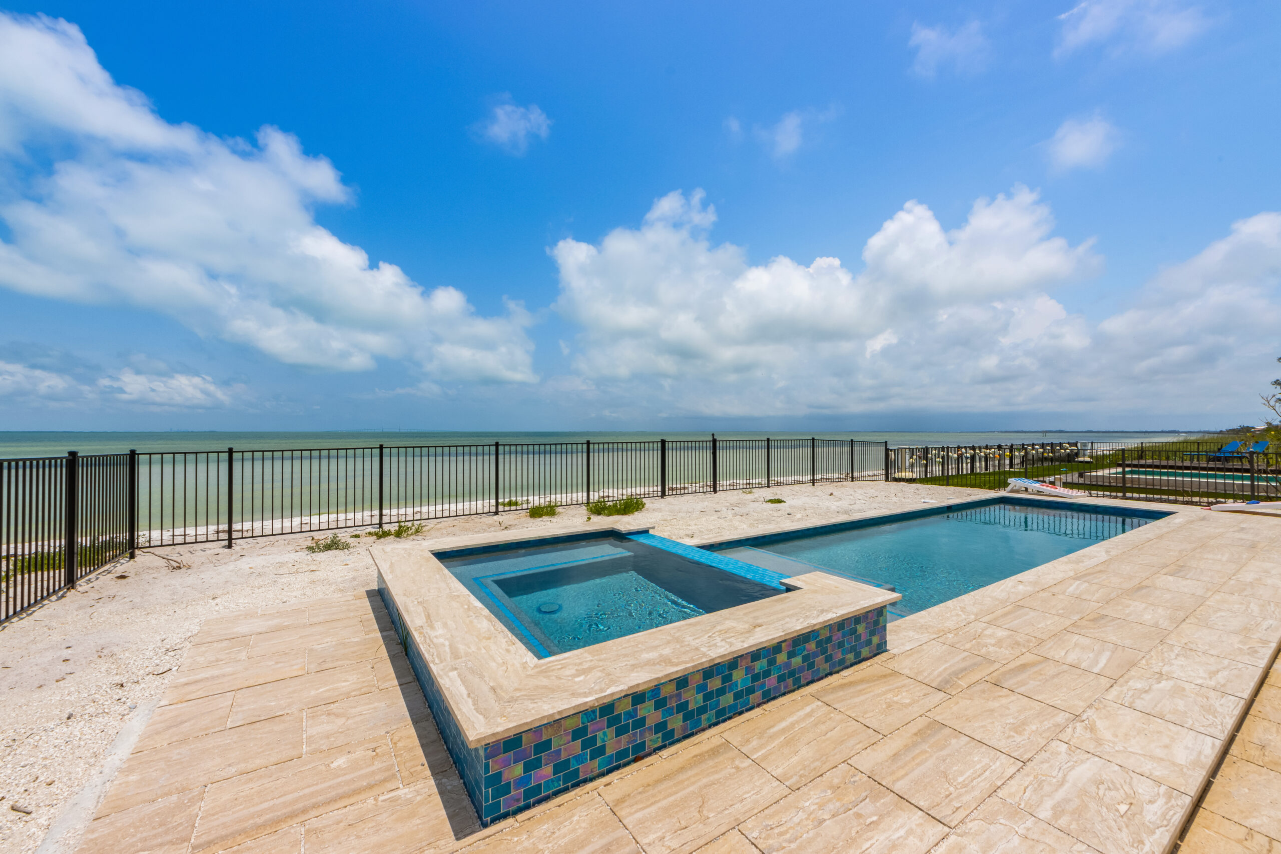 Mimosa Bay, a renovated Spanish-style bayfront home with a private beach on Anna Maria Island